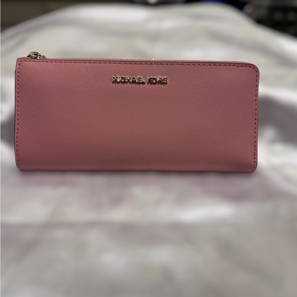 Michael Kors Jet Set Pink Saffiano leather long quarter zip around wallet.